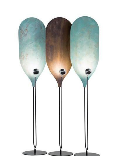 Three panel floor lamps with blue-green and brown surfaces on round black bases