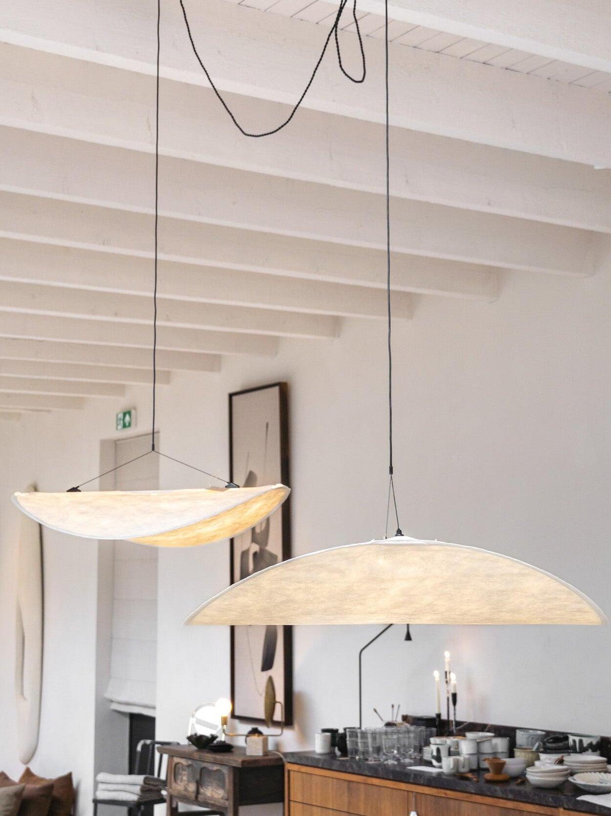Two warm-looking shades above a kitchen counter