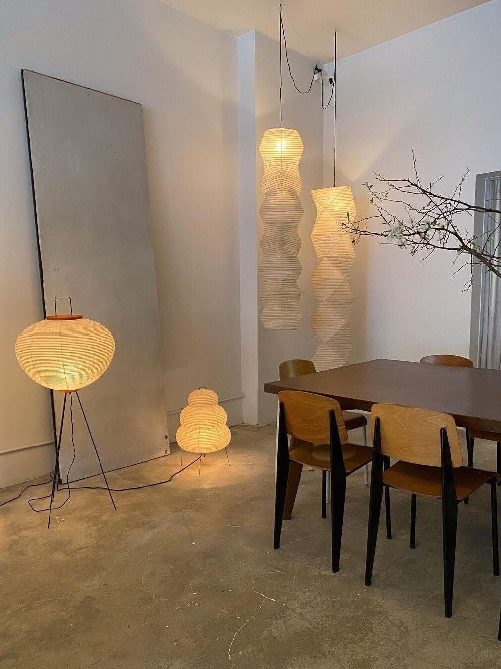 Room with round floor lamp and separate sculptural lights