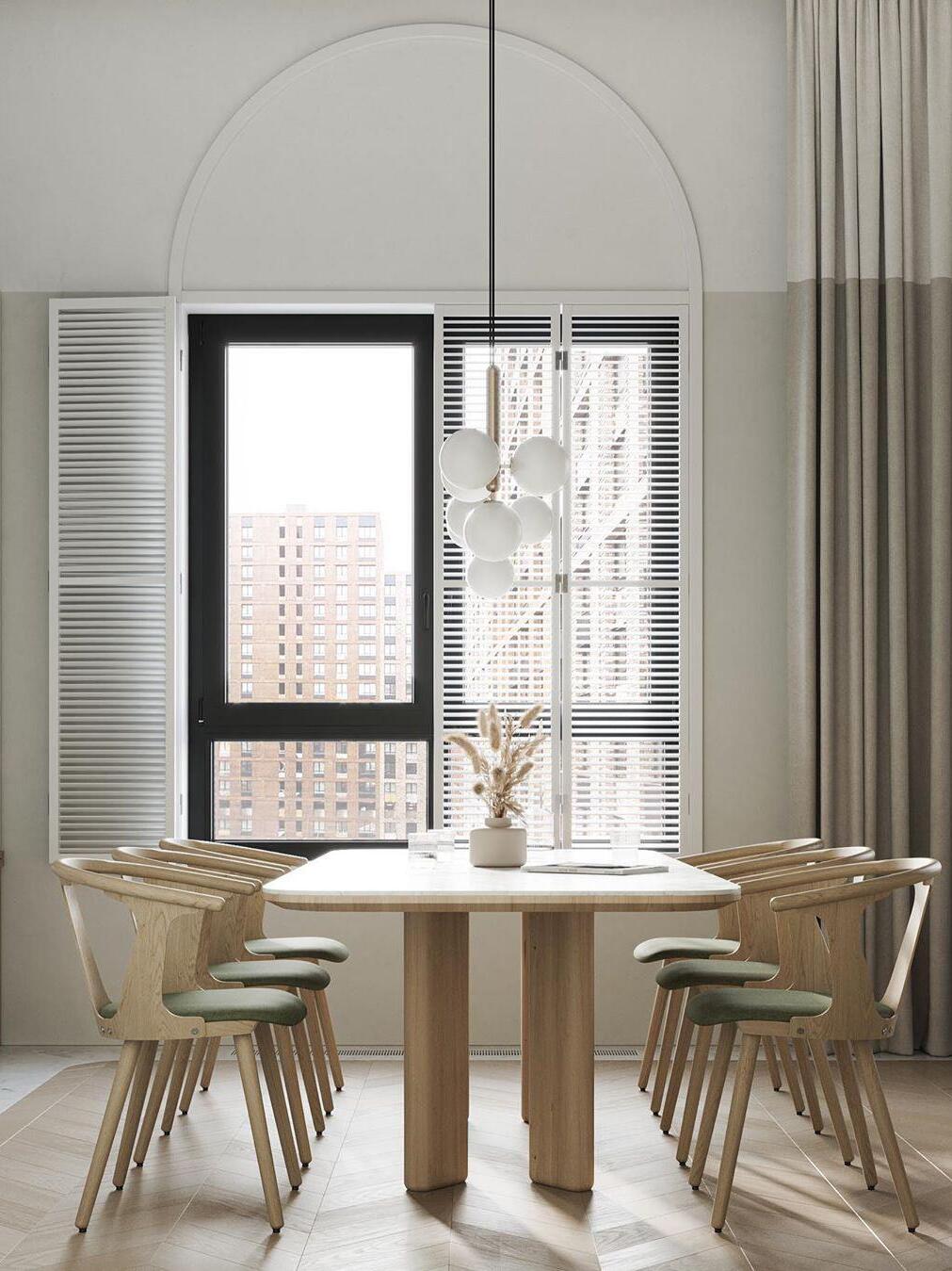 Glass globe cluster above a round dining table