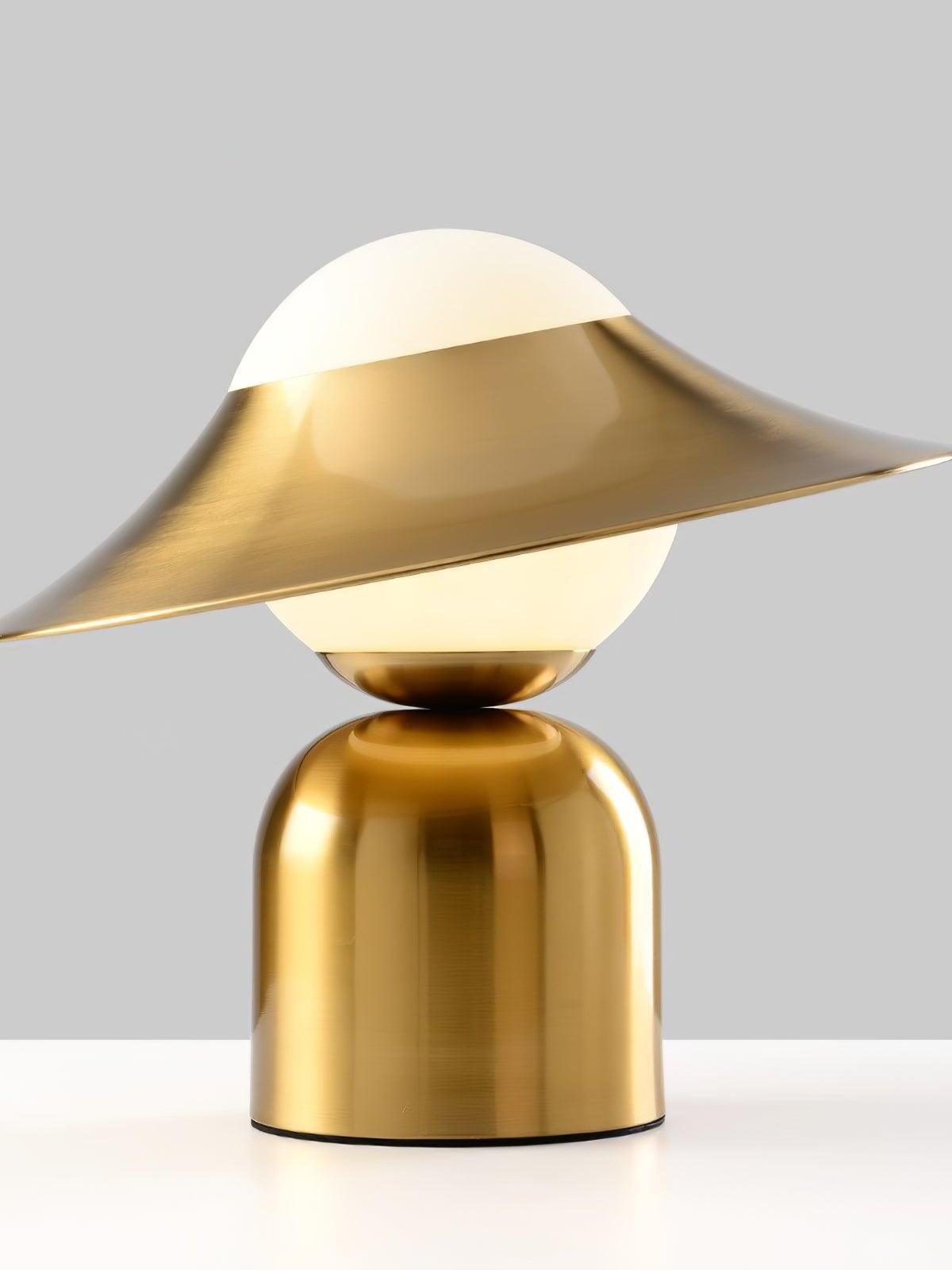 White globe crossed by tilted gold disc, side profile