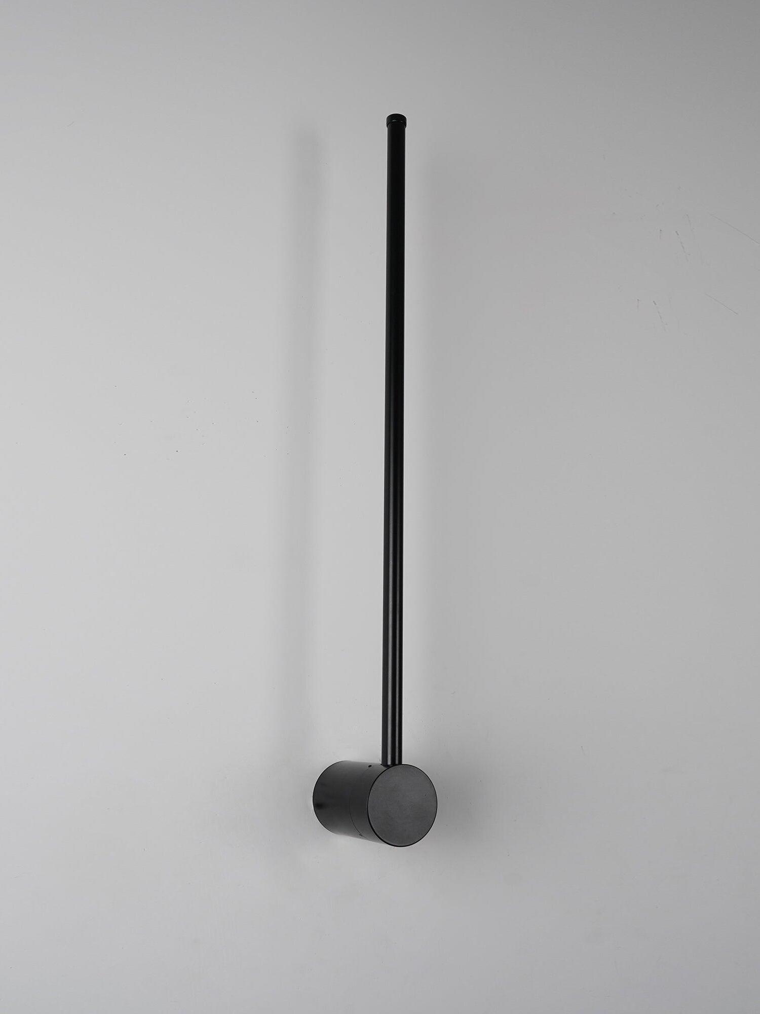Side view of the unlit black rod fixture