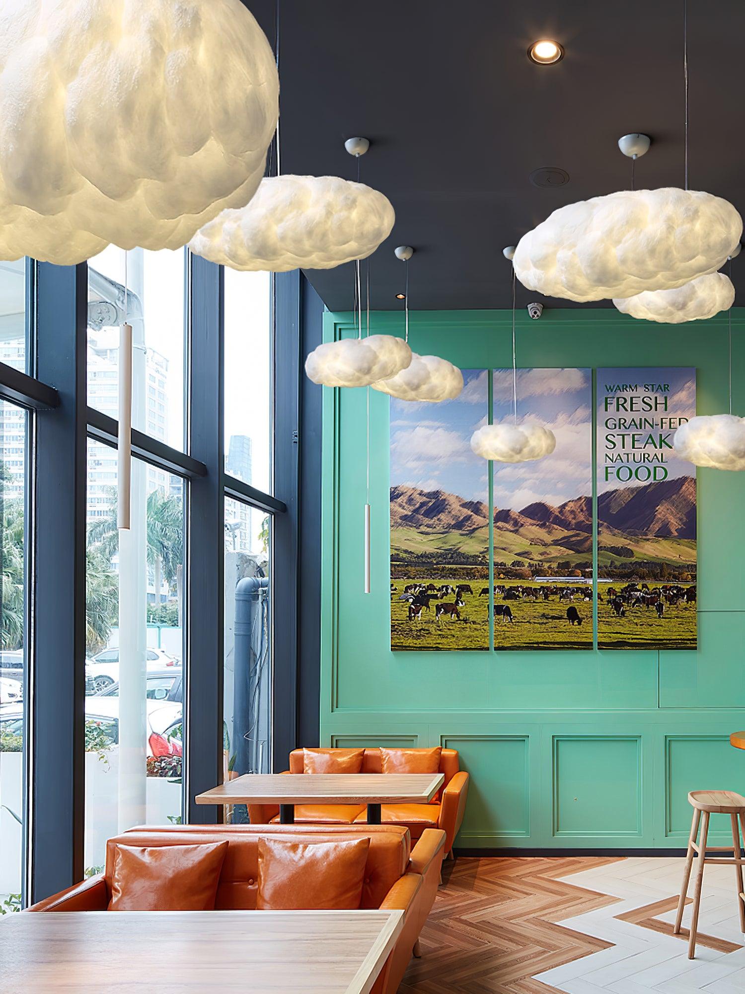 Cloud pendants near tall windows and cafe seating