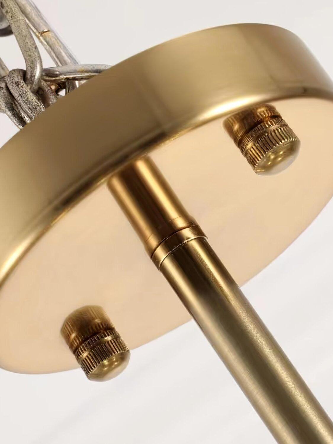 Round gold ceiling canopy and suspension rod detail