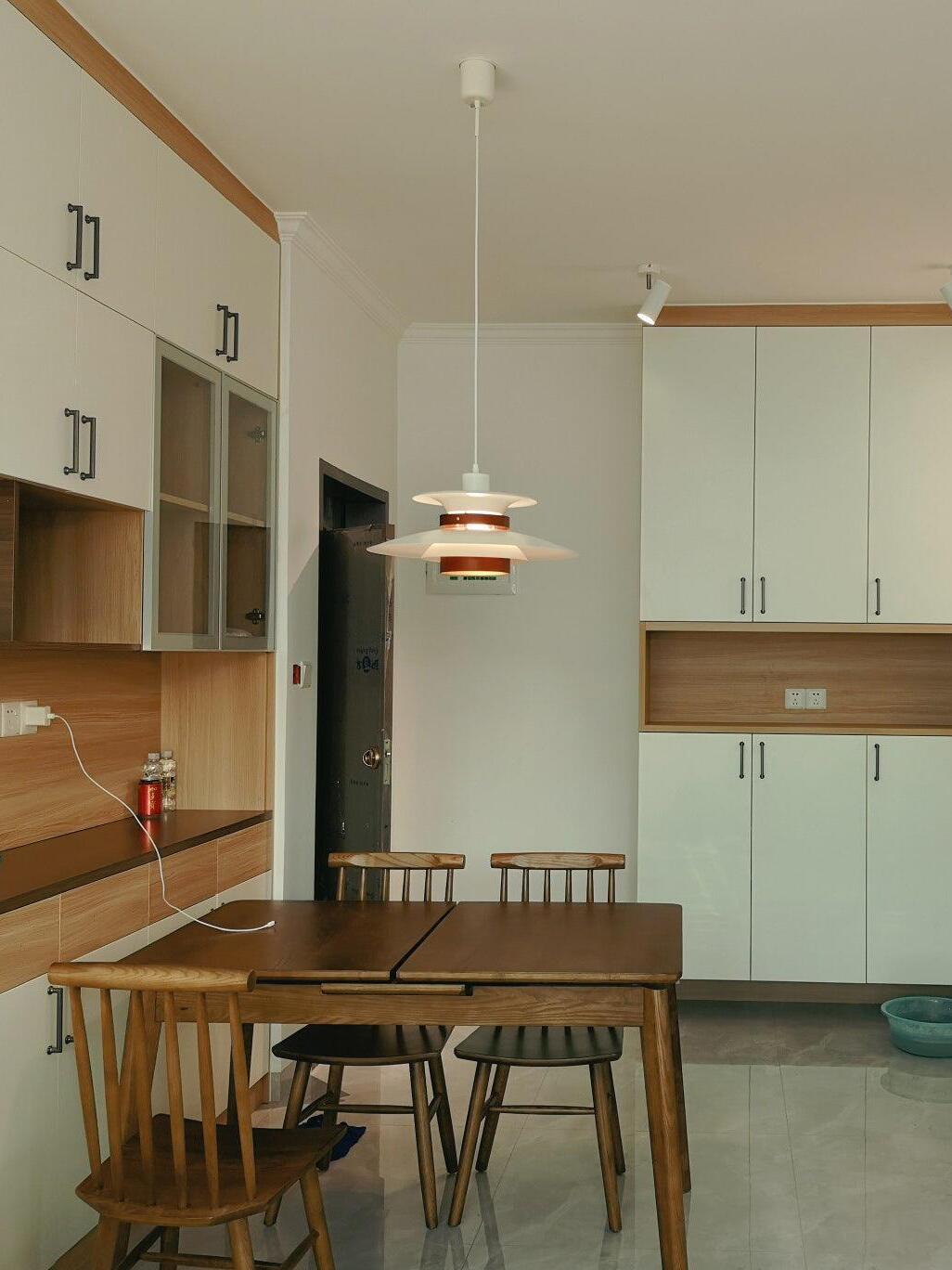White pendant above a kitchen dining area