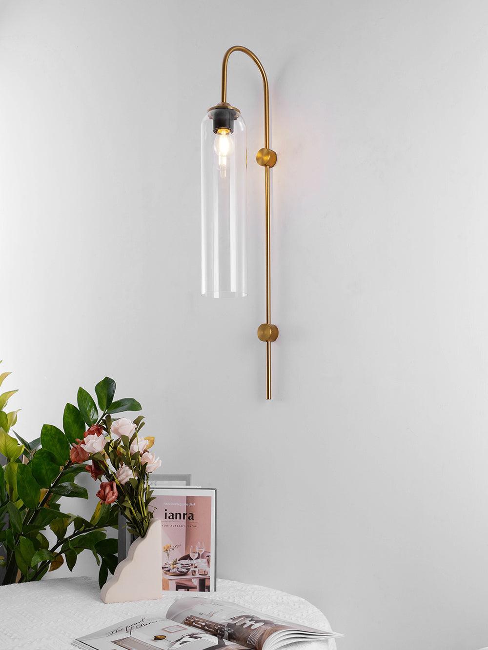 Clear glass shade suspended from a gold-coloured arch