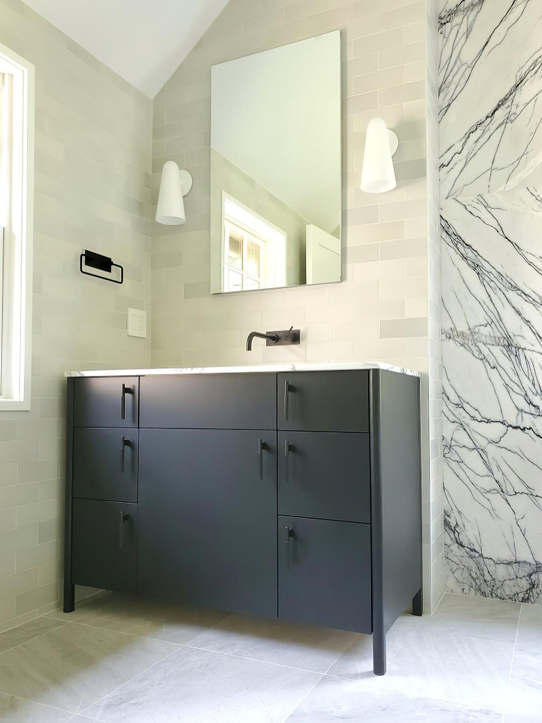 Pale wall shade in a tiled vanity setting