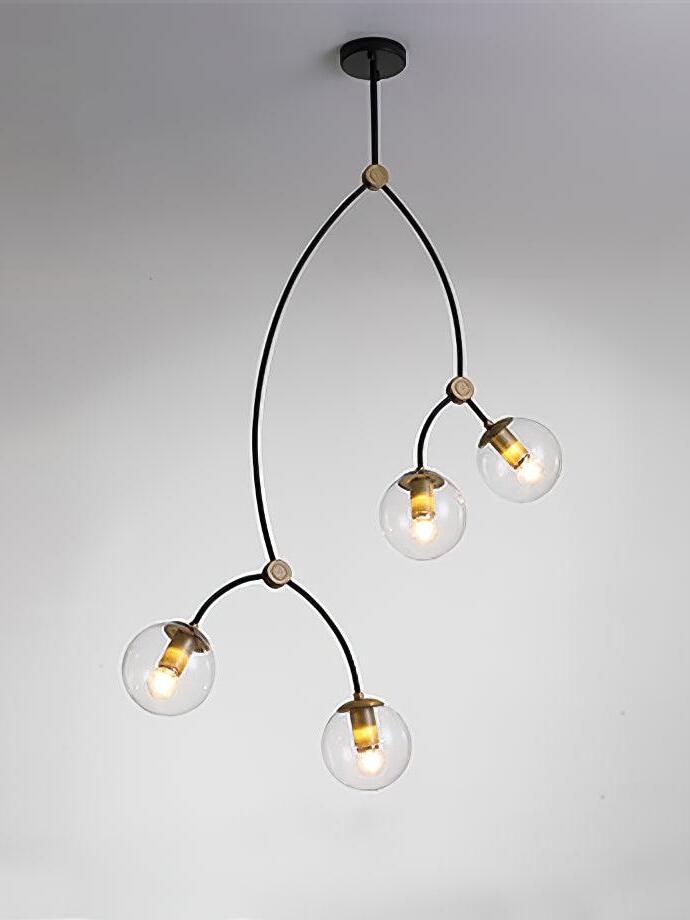 Four clear glass globes on a tall branching black chandelier