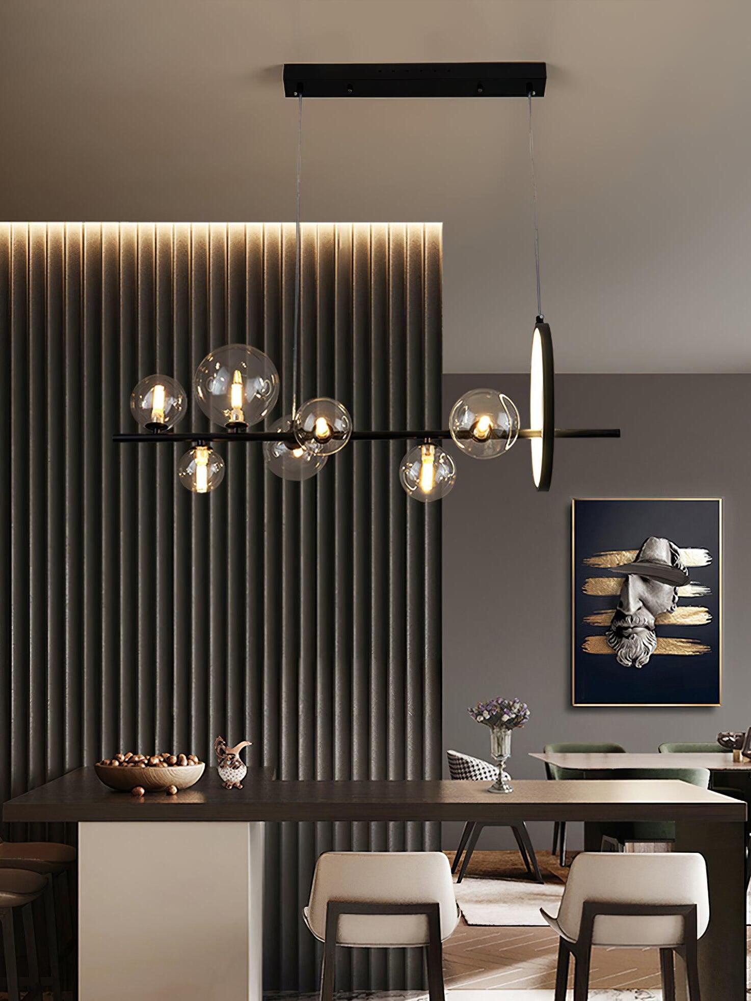 Glass globes and lit ring against a vertical slatted wall