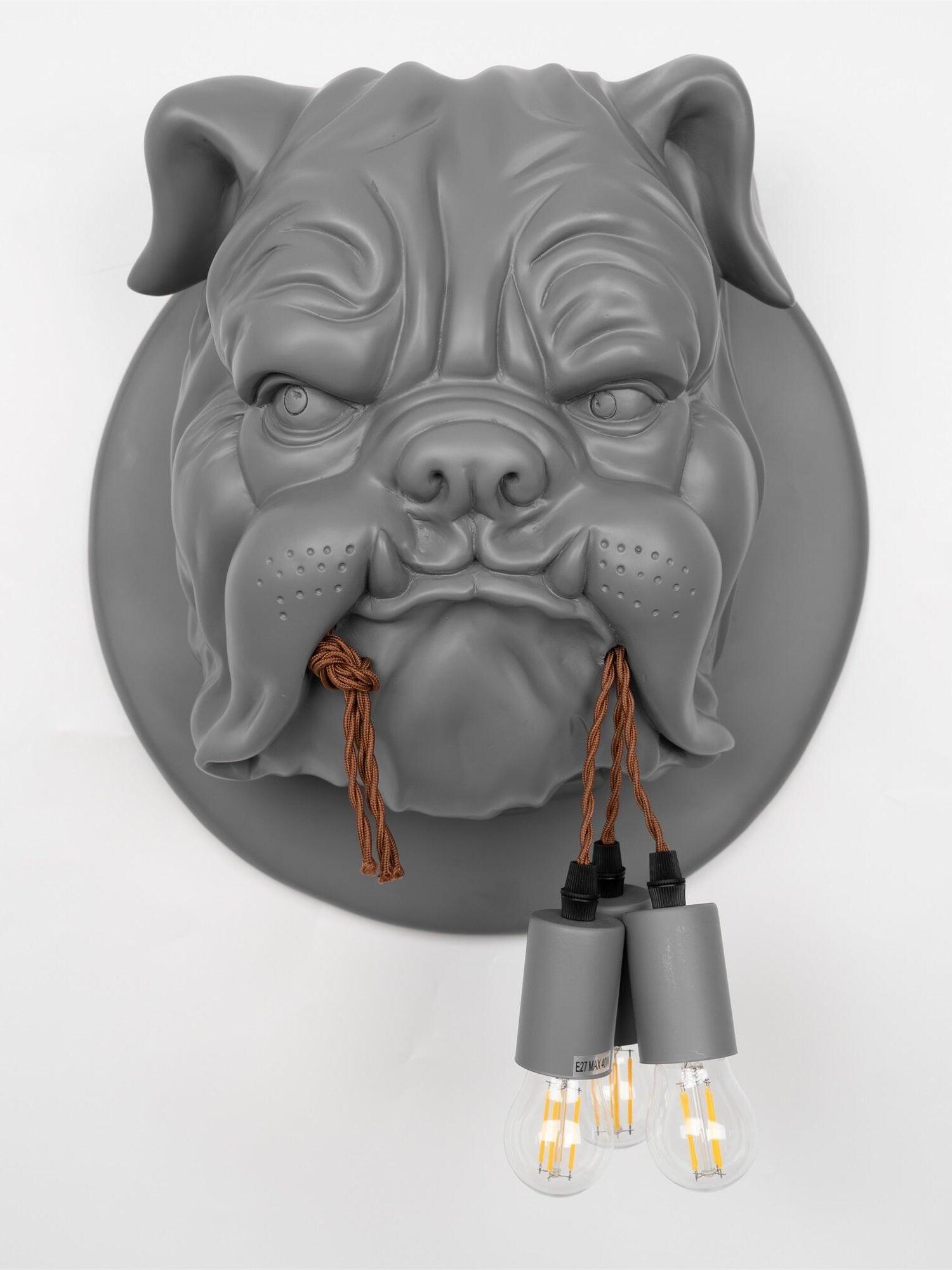 Matte grey bulldog head holding brown cords with three bulb holders