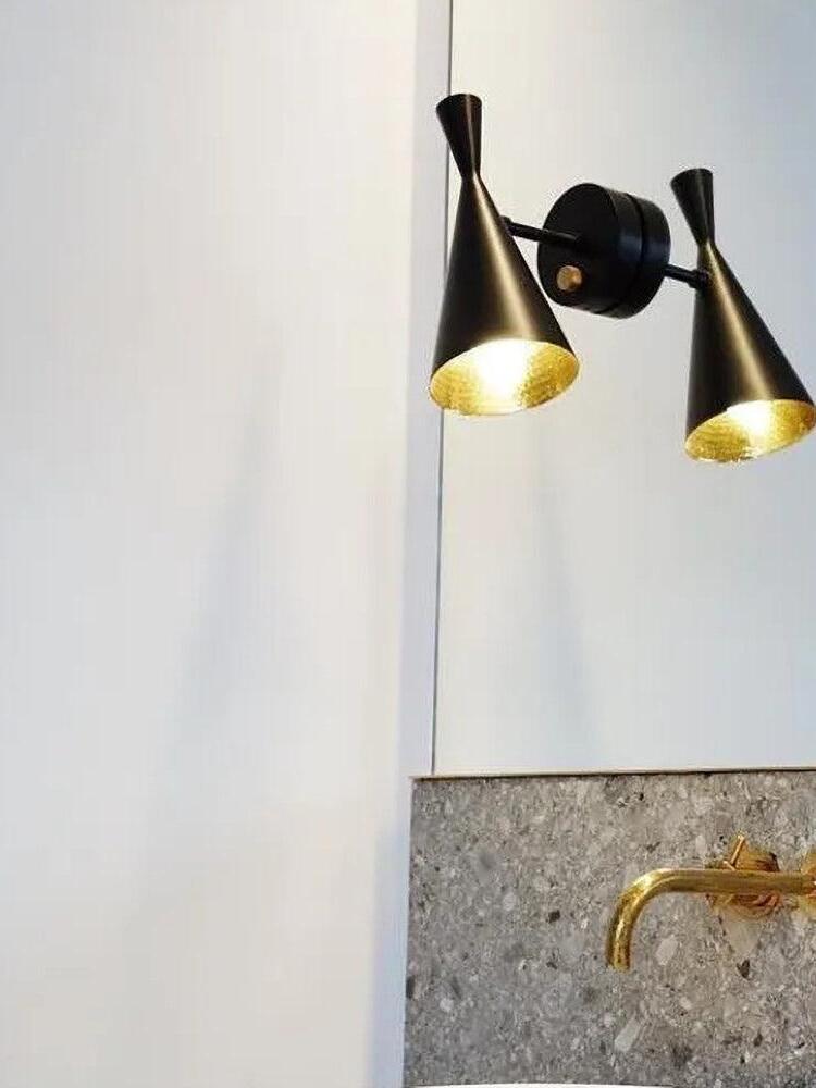 Dual-cone wall fixture with two lit shades on one backplate