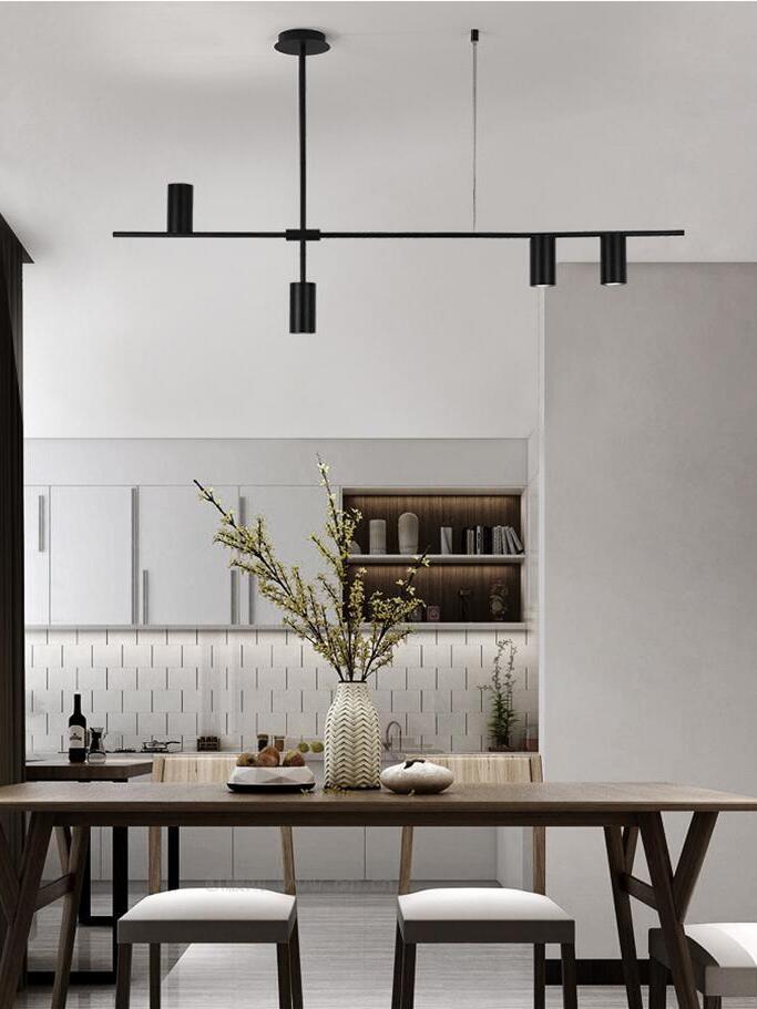 Black linear chandelier in a dining room