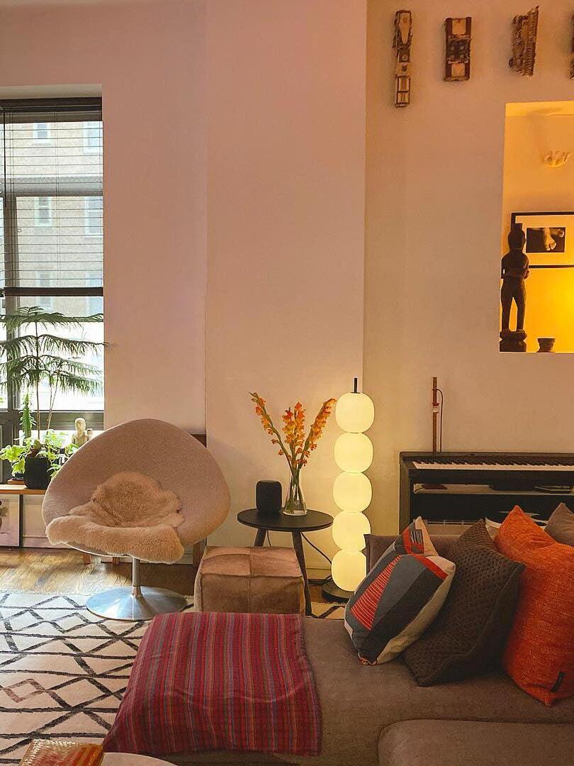 Globe floor lamp in colourful living room