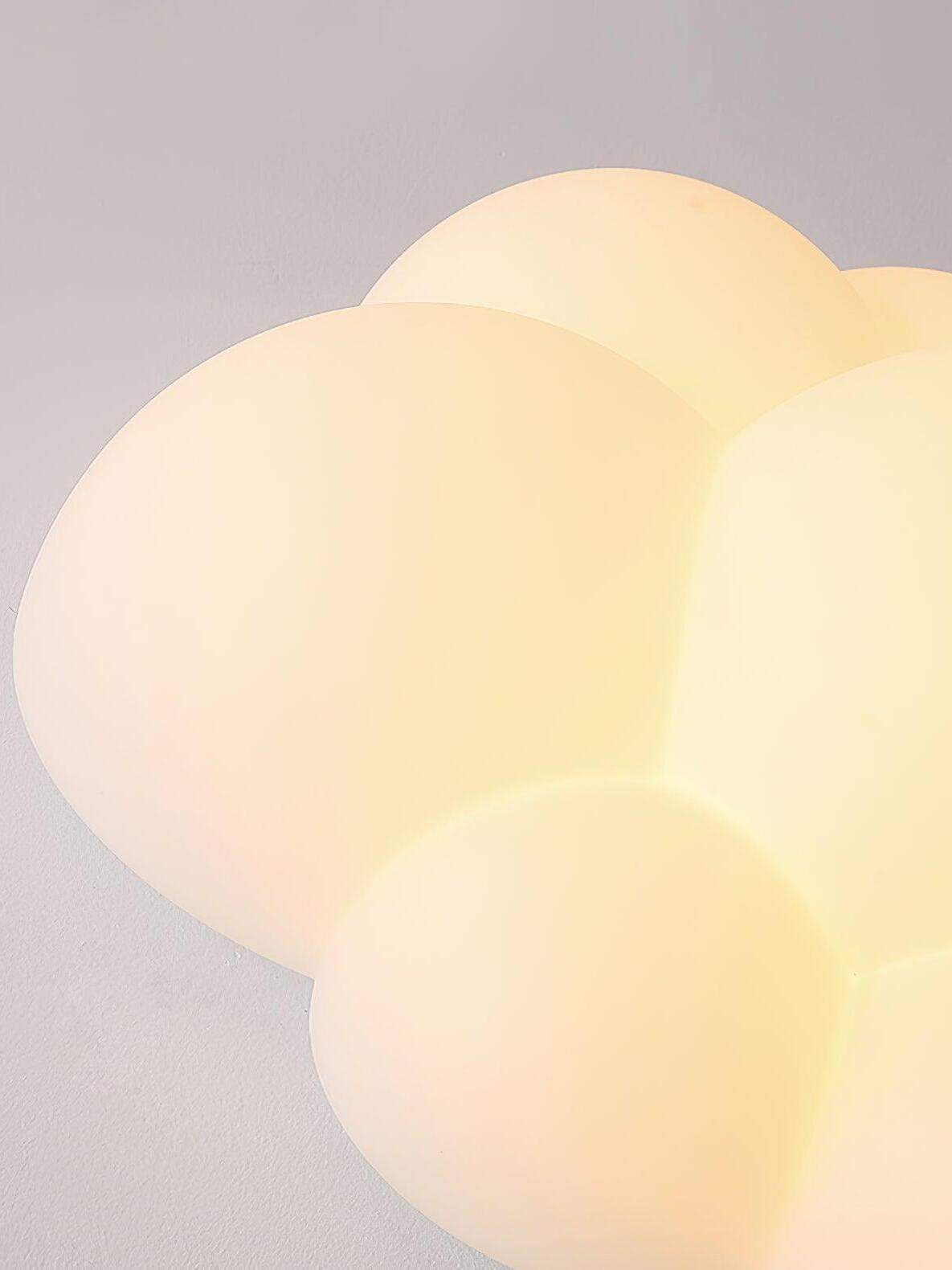 Close-up of the glowing overlapping lobes of a Nuage ceiling light