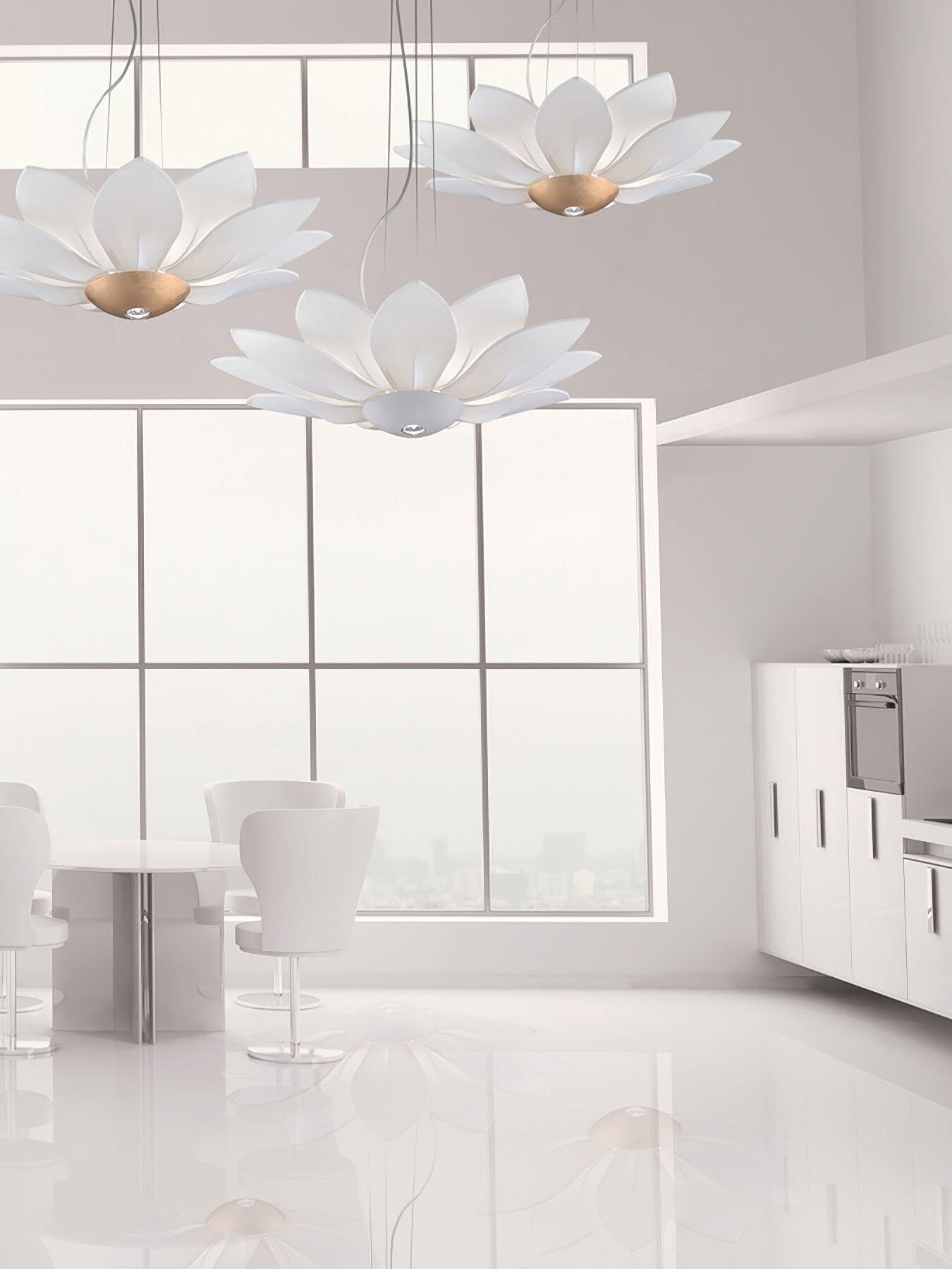 Several white flower chandeliers in bright large room