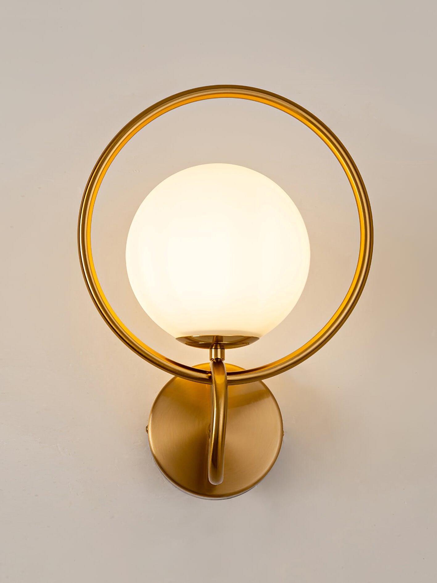 Front view of glowing globe within gold oval ring