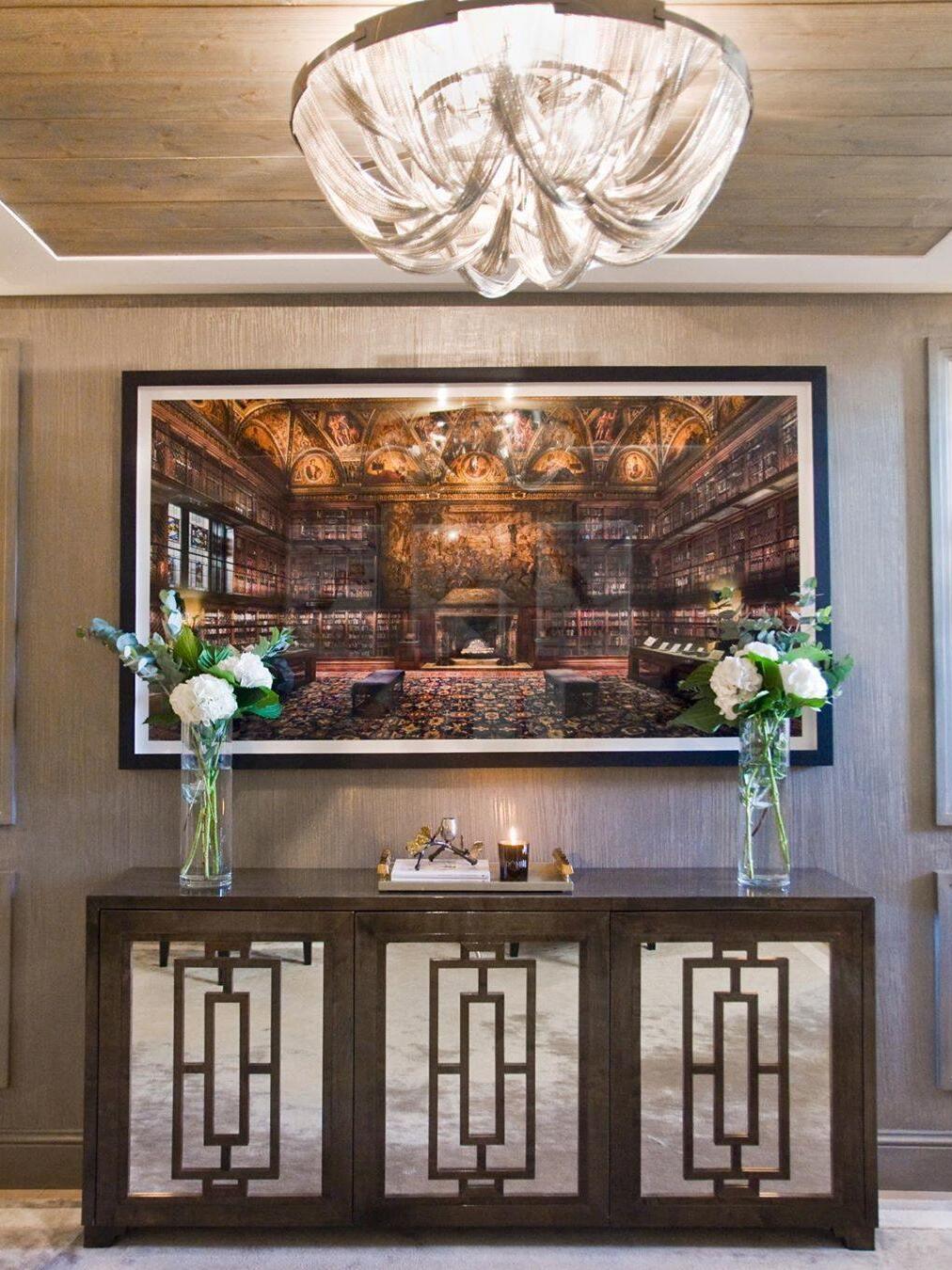 Silver chain ceiling light over mirrored console