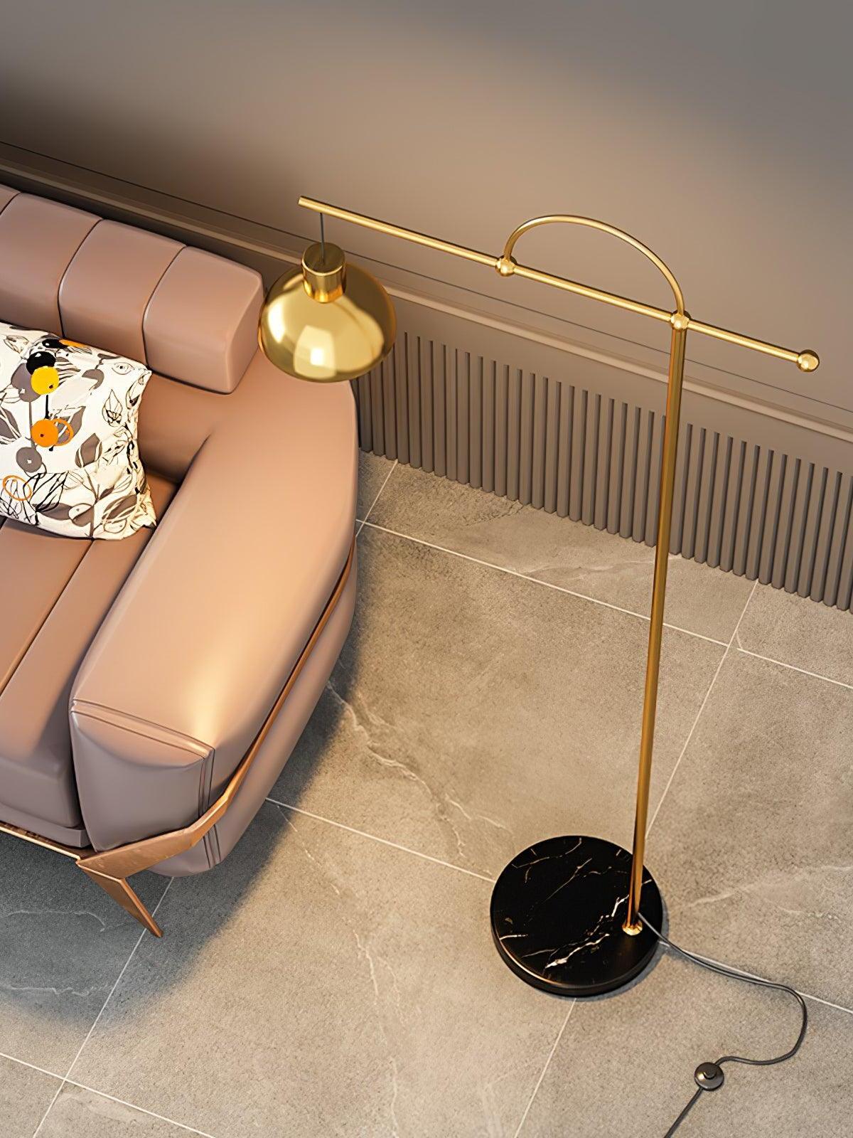 Nidal gold-colour crossbar and round veined marble base from above