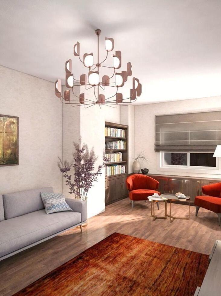 Rose-gold-coloured tiered chandelier in a living area