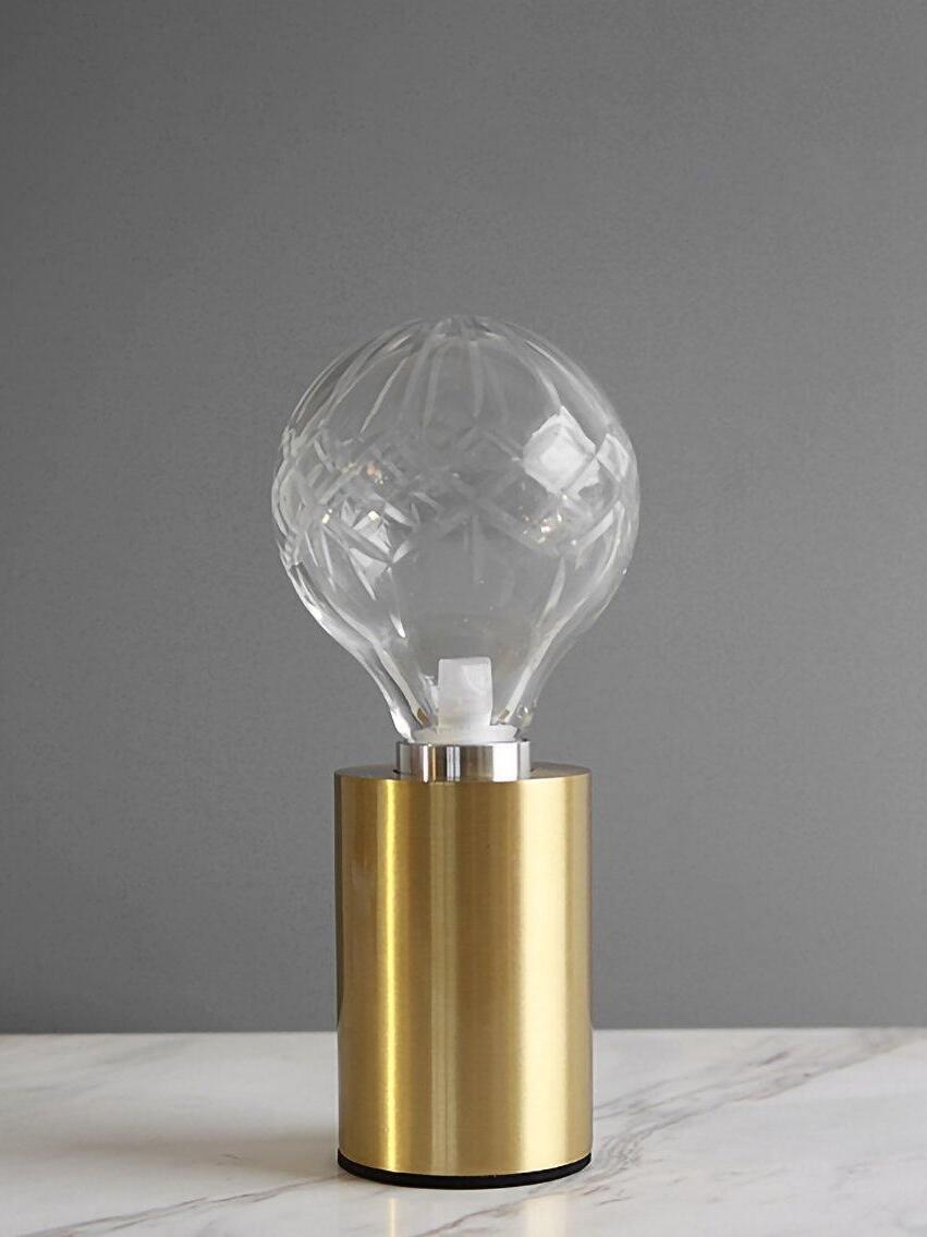 Large-faceted clear globe on satin gold-tone cylindrical base