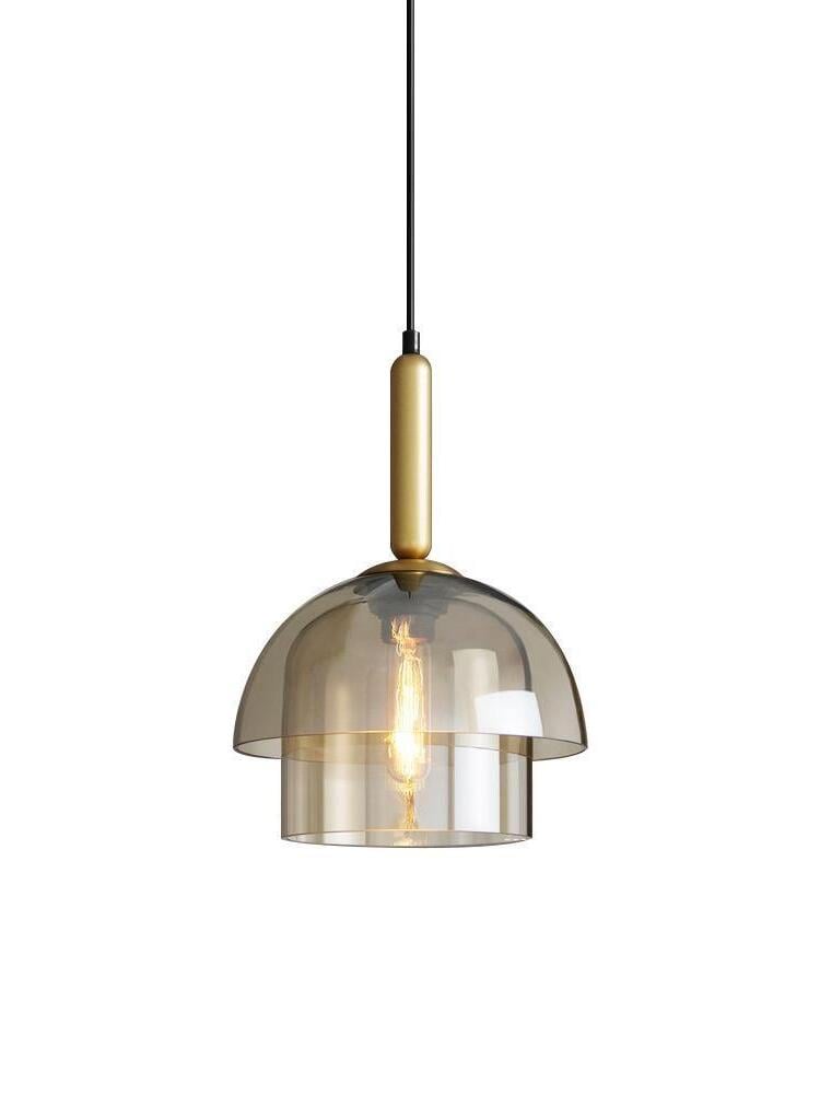 Two-tier amber glass pendant isolated on white, with dome, lower cylinder, visible filament bulb and gold-tone fitting