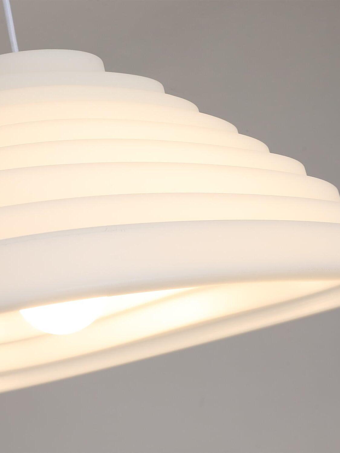 Close-up of the stepped white shade surface and glowing open rim.