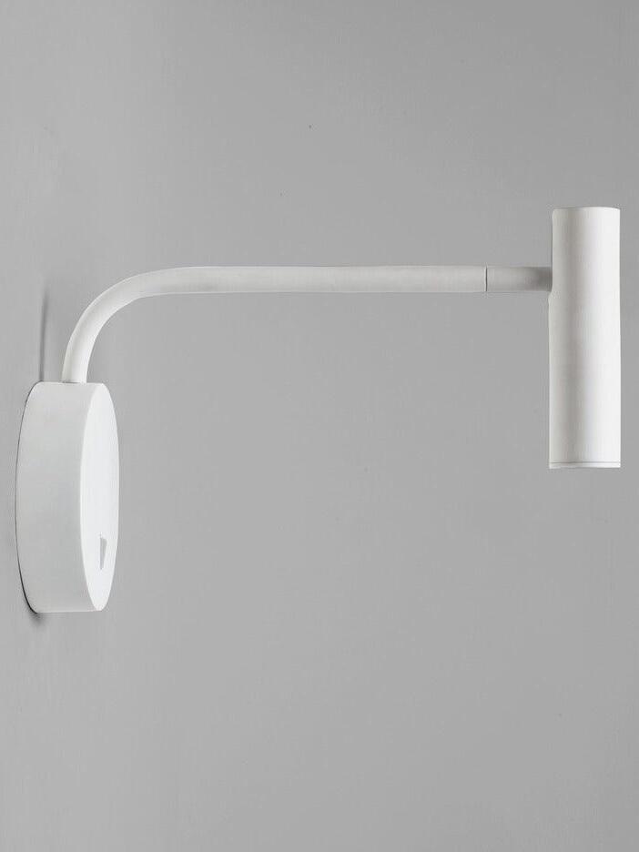 Side view of white L-arm reading sconce