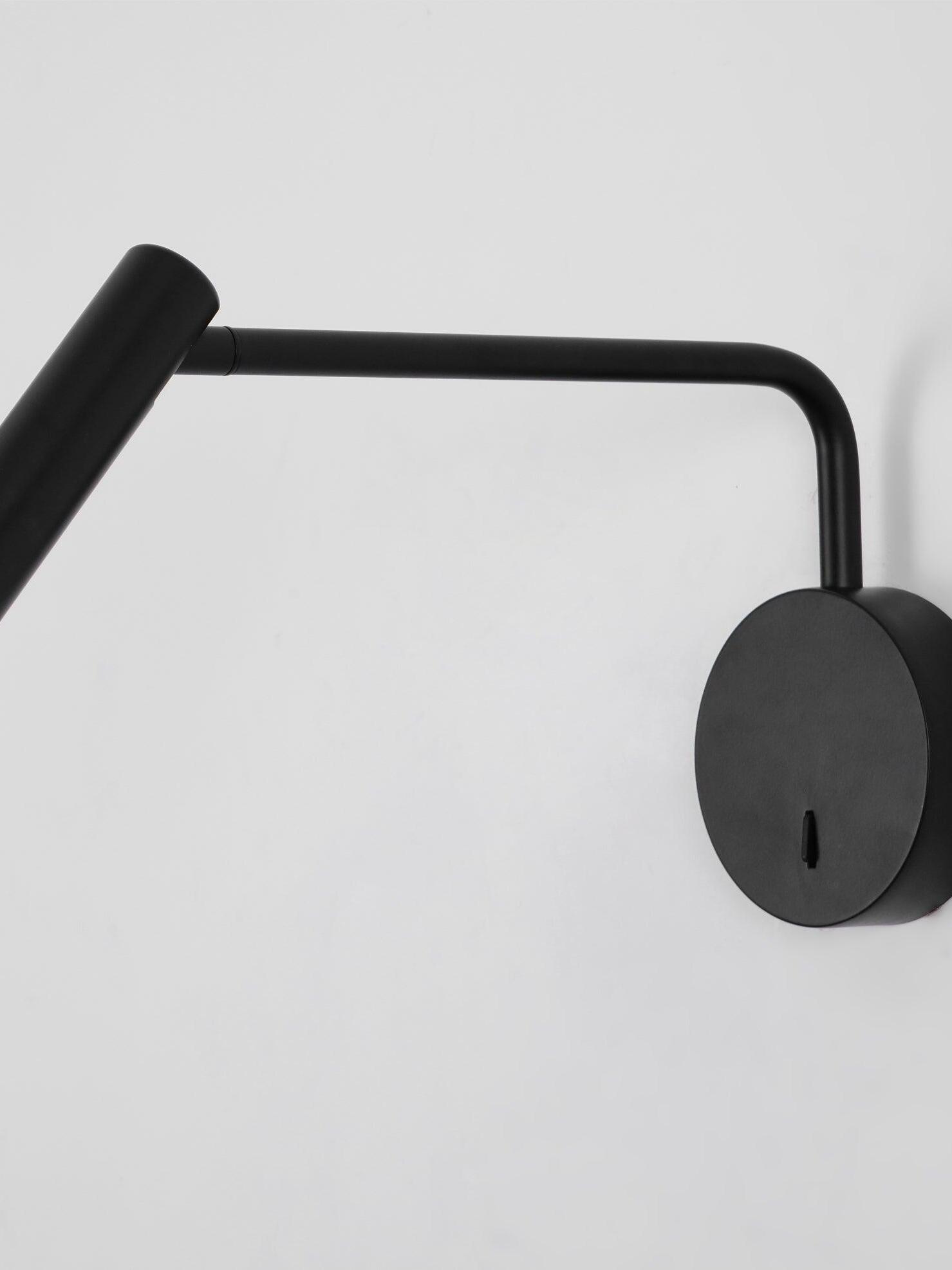 Black curved arm and round plate close-up