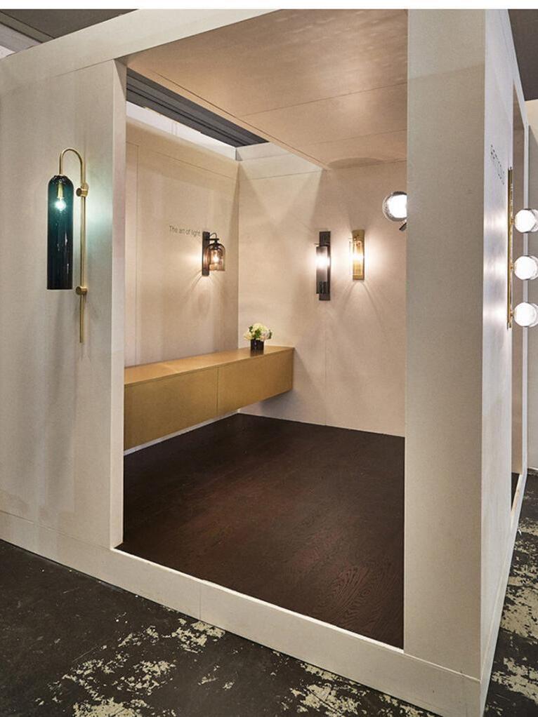 Glass wall lights shown in a bathroom scene