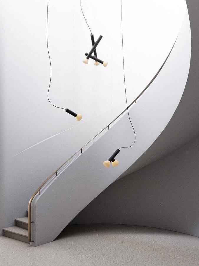 Single and multi-head pendants beside a curved stair