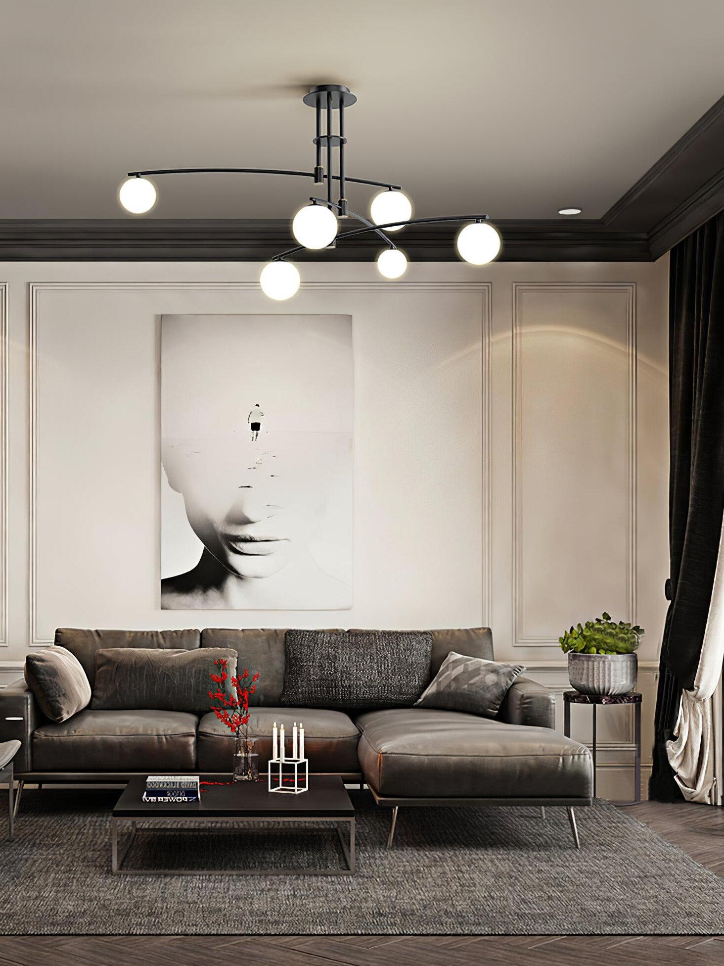 Black chandelier over a sofa and coffee table