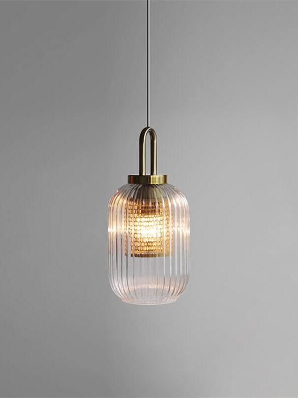 Elongated clear ribbed-glass pendant with a gold-coloured top loop