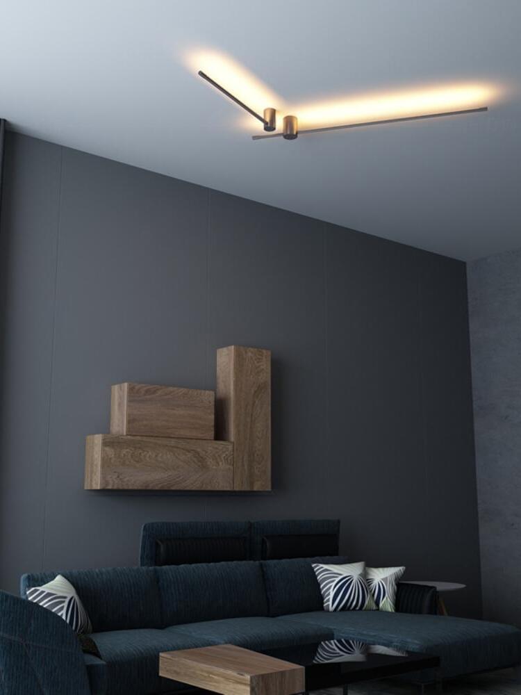 Linear LED rods mounted on a ceiling above a living room