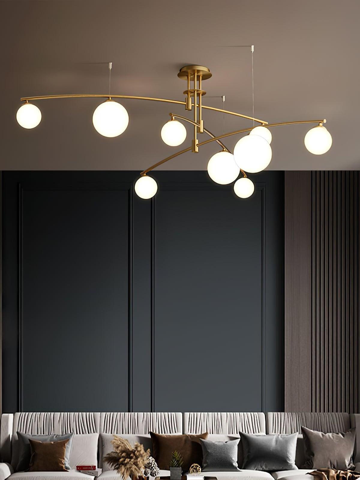 Gold nine-head chandelier over a living-room seating area