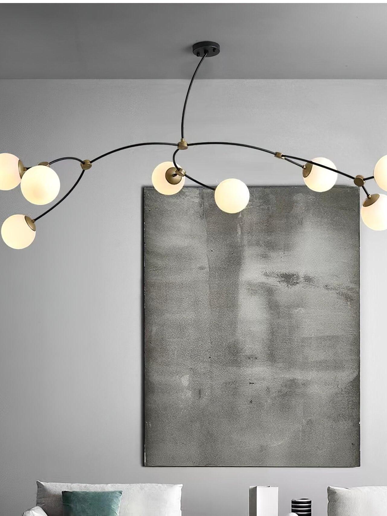 White globe chandelier above framed wall art
