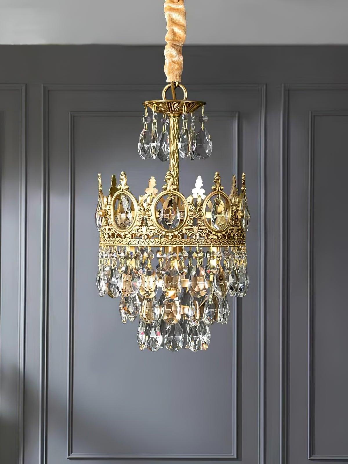 Narrow crown-style crystal chandelier with a covered suspension in front of dark wall panels