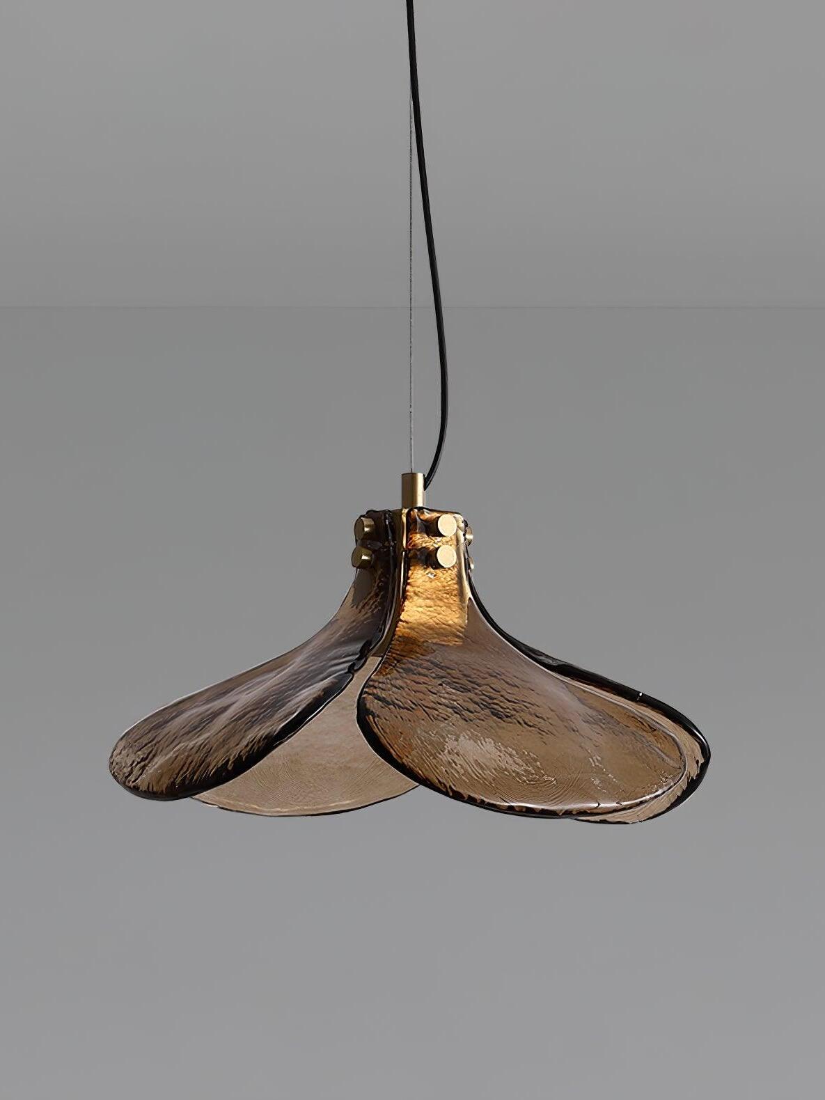 Unlit brown three-lobed glass pendant on dark cord