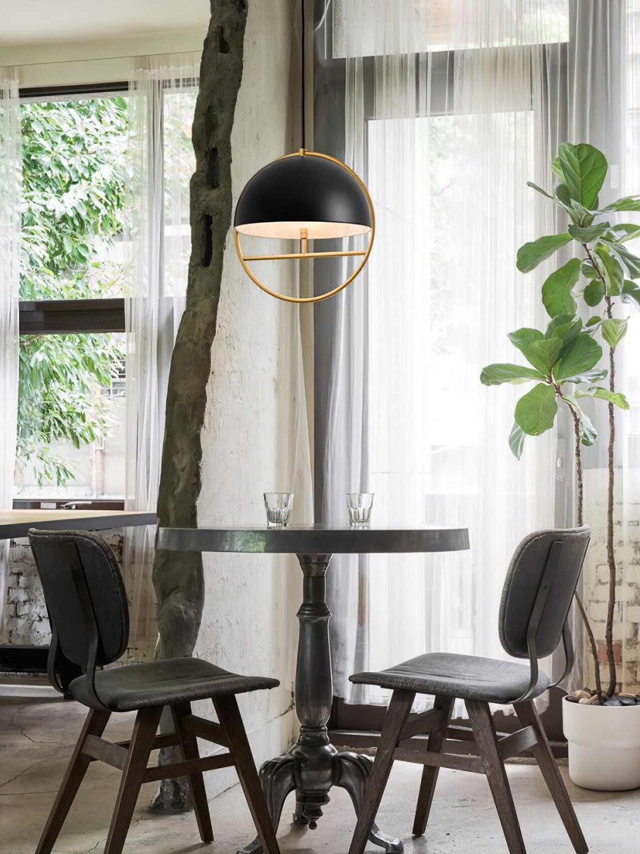 Black ring pendant beside window and dining table