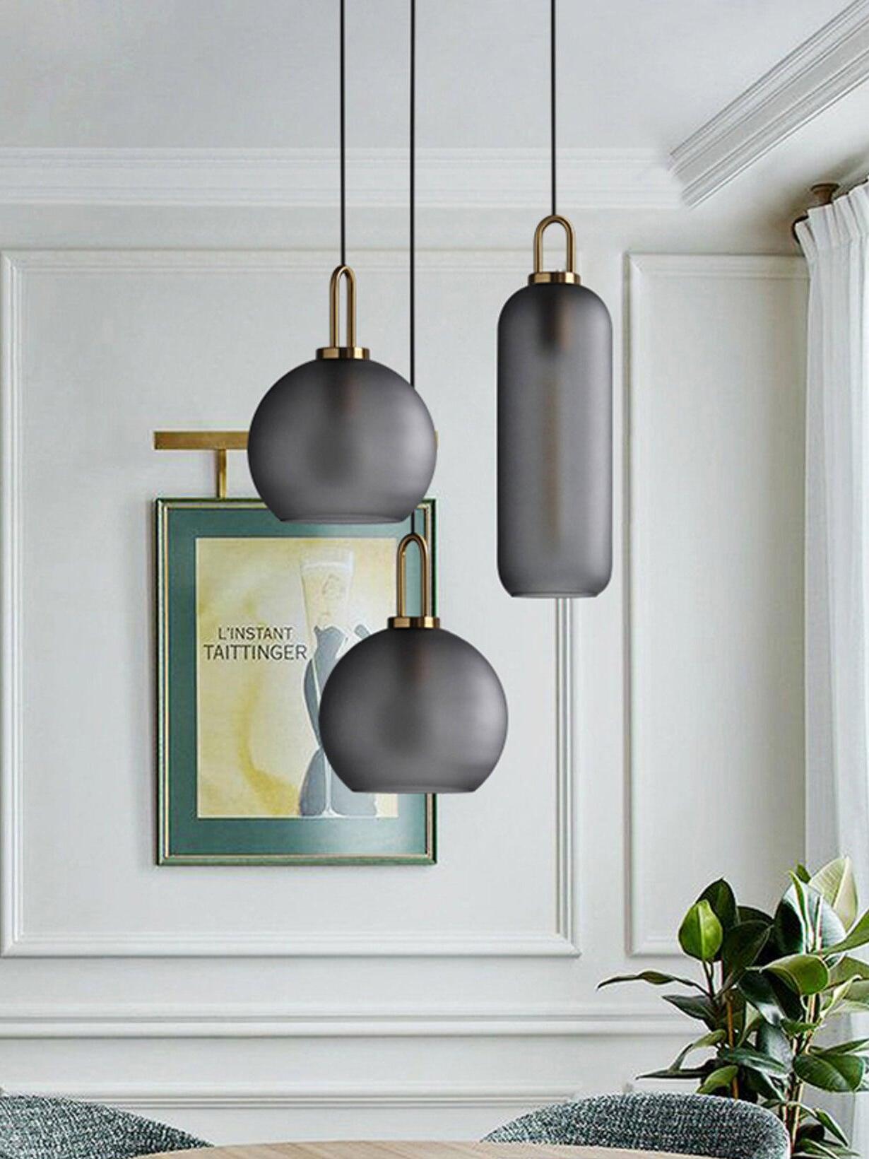 Mixed frosted glass shapes beside framed artwork