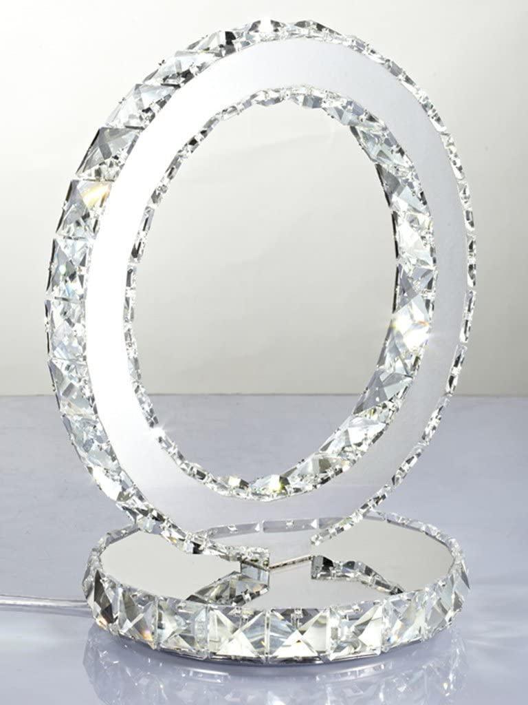 Front angled view of the ring lamp with clear faceted edges and a reflective base