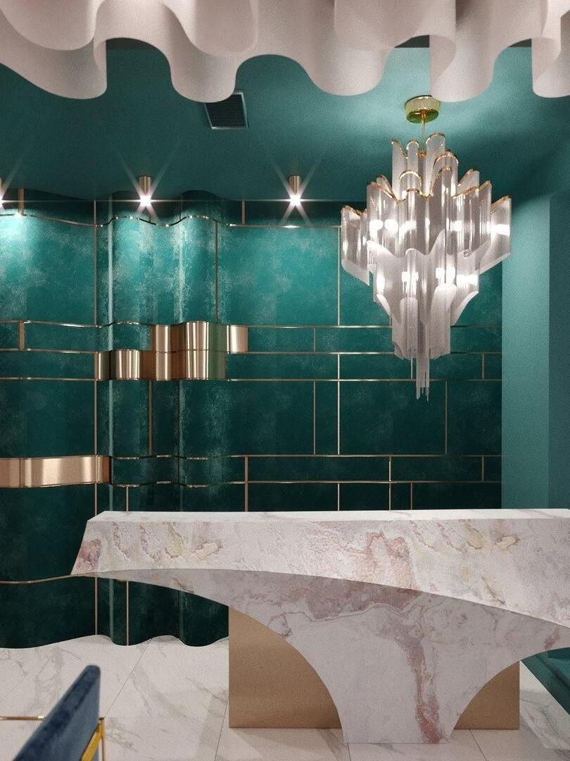 Layered chain chandelier near green wall panels