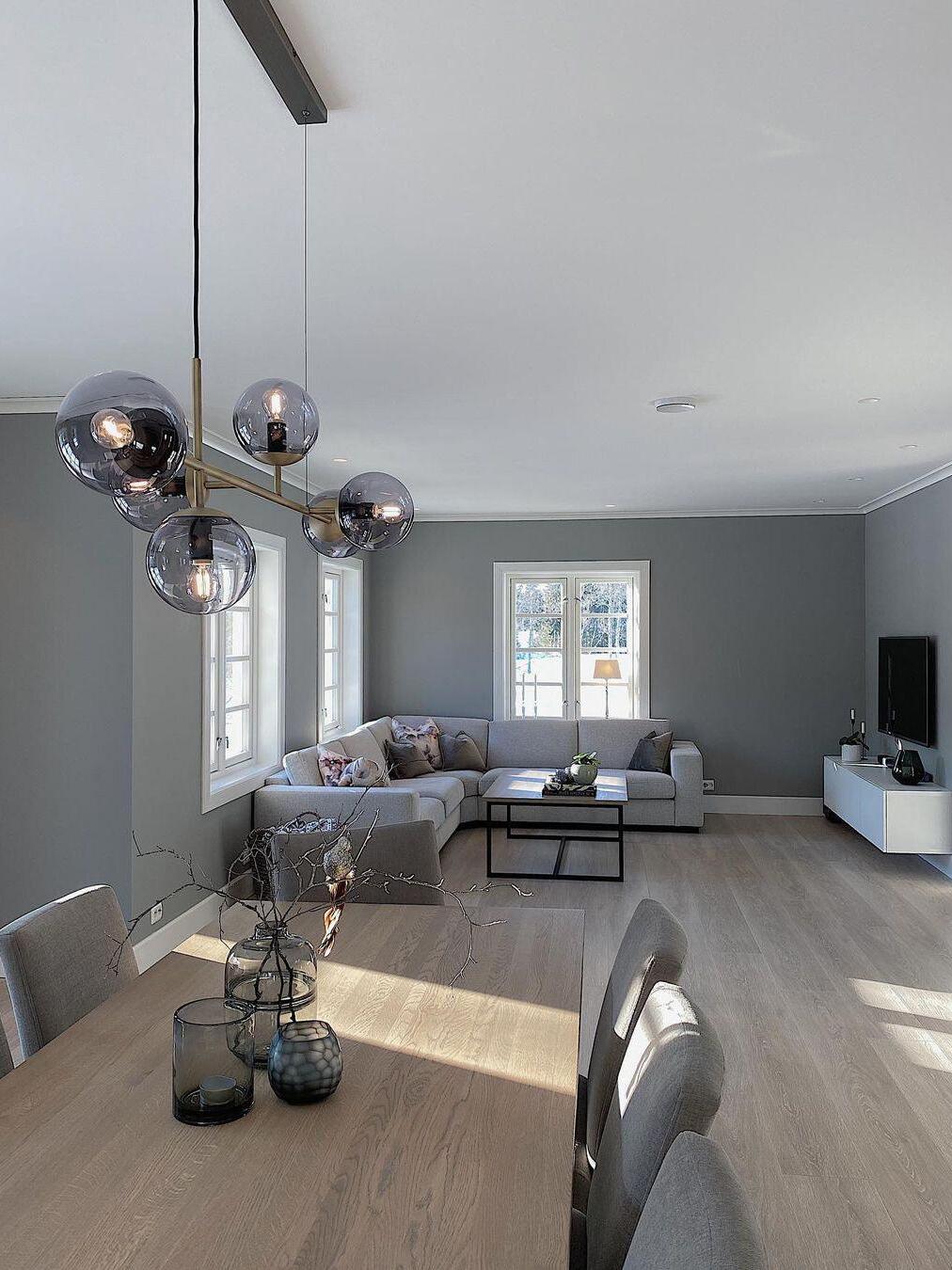 Glass-globe chandelier in an open living area