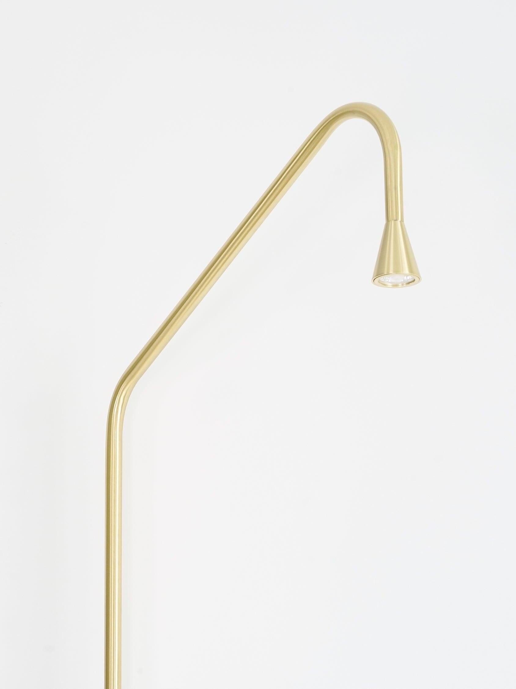 Golden angled arm and small tapered head detail