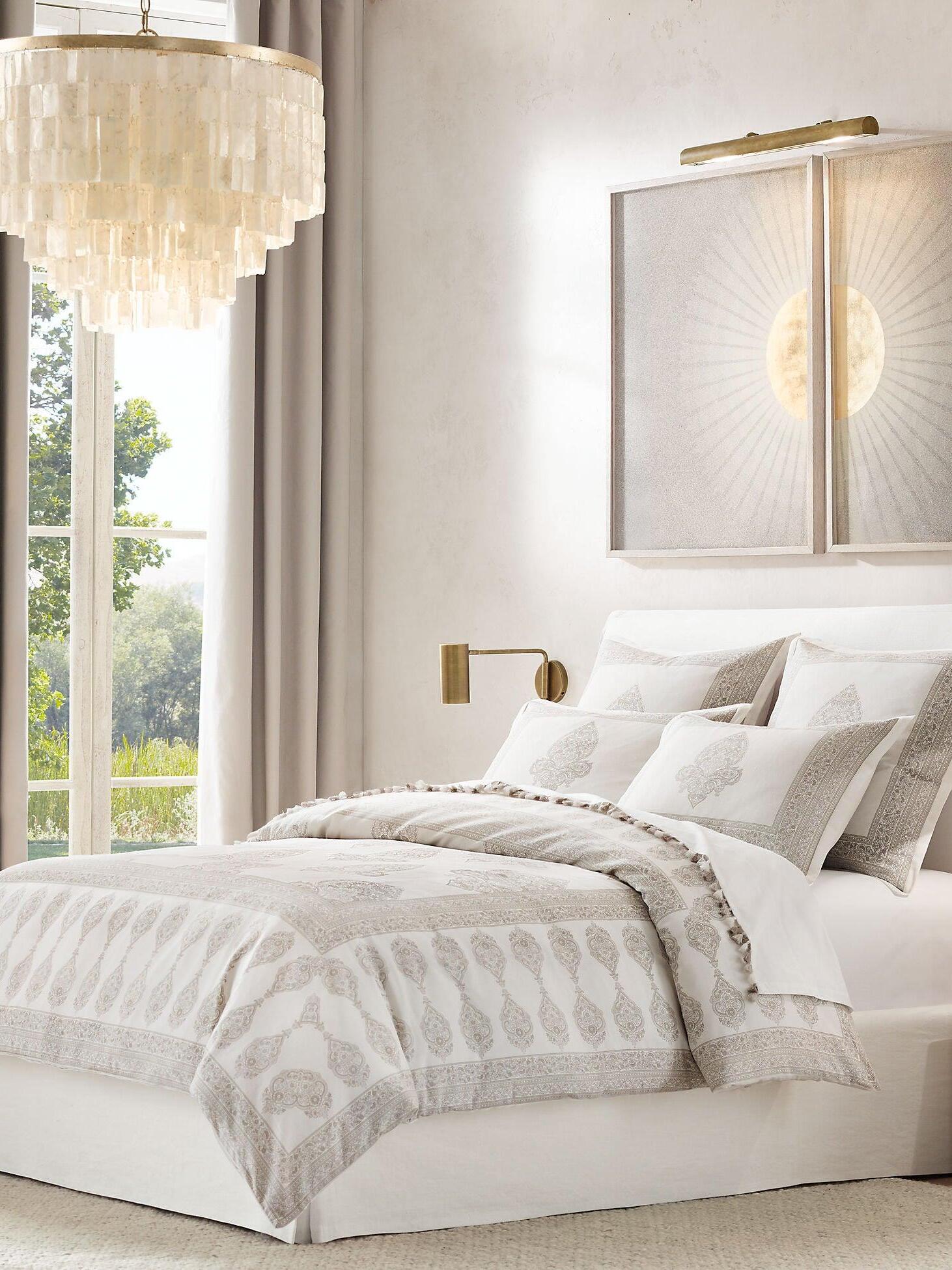 Shell pendant beside a large window in a bedroom
