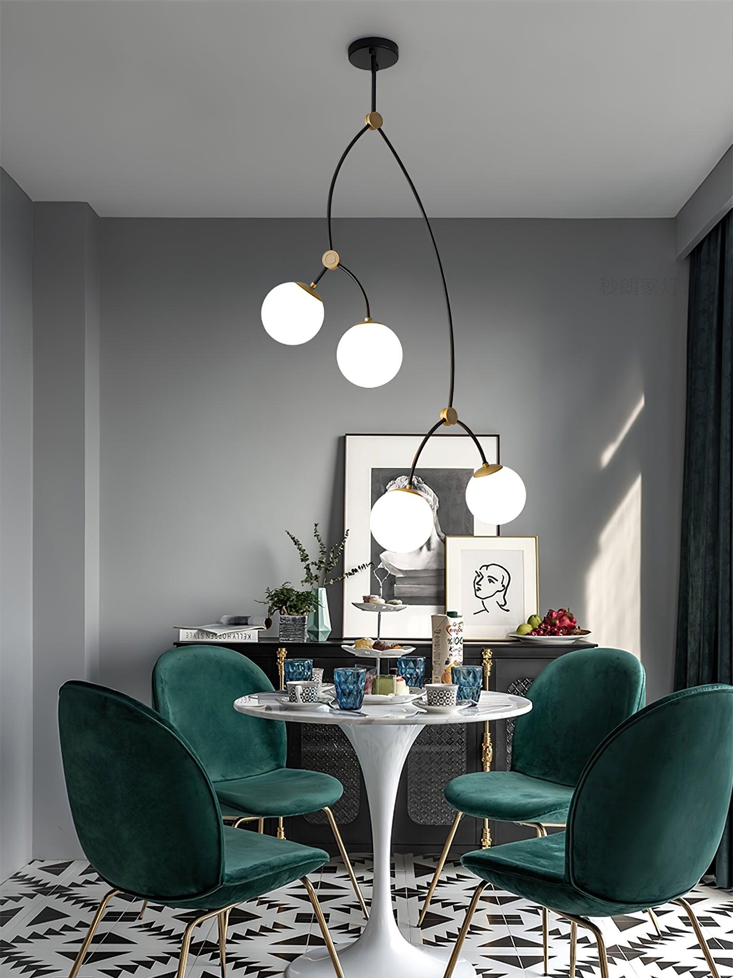 White branching chandelier over a round dining table