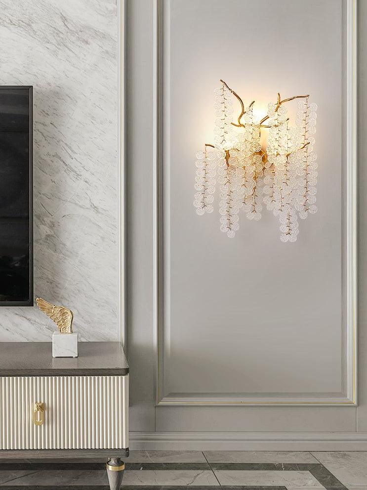 Branched clear-disc lamp on a panelled wall
