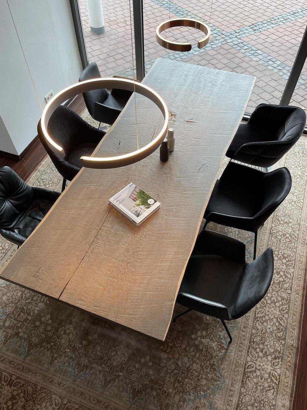 Overhead view of ring pendants above a long table
