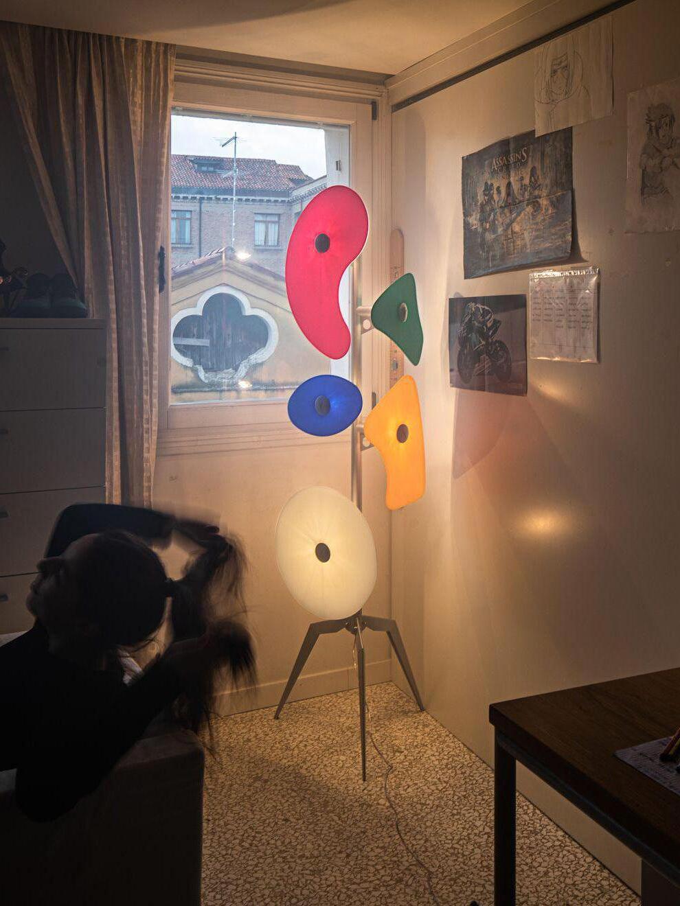 Multicolour floor lamp near a window