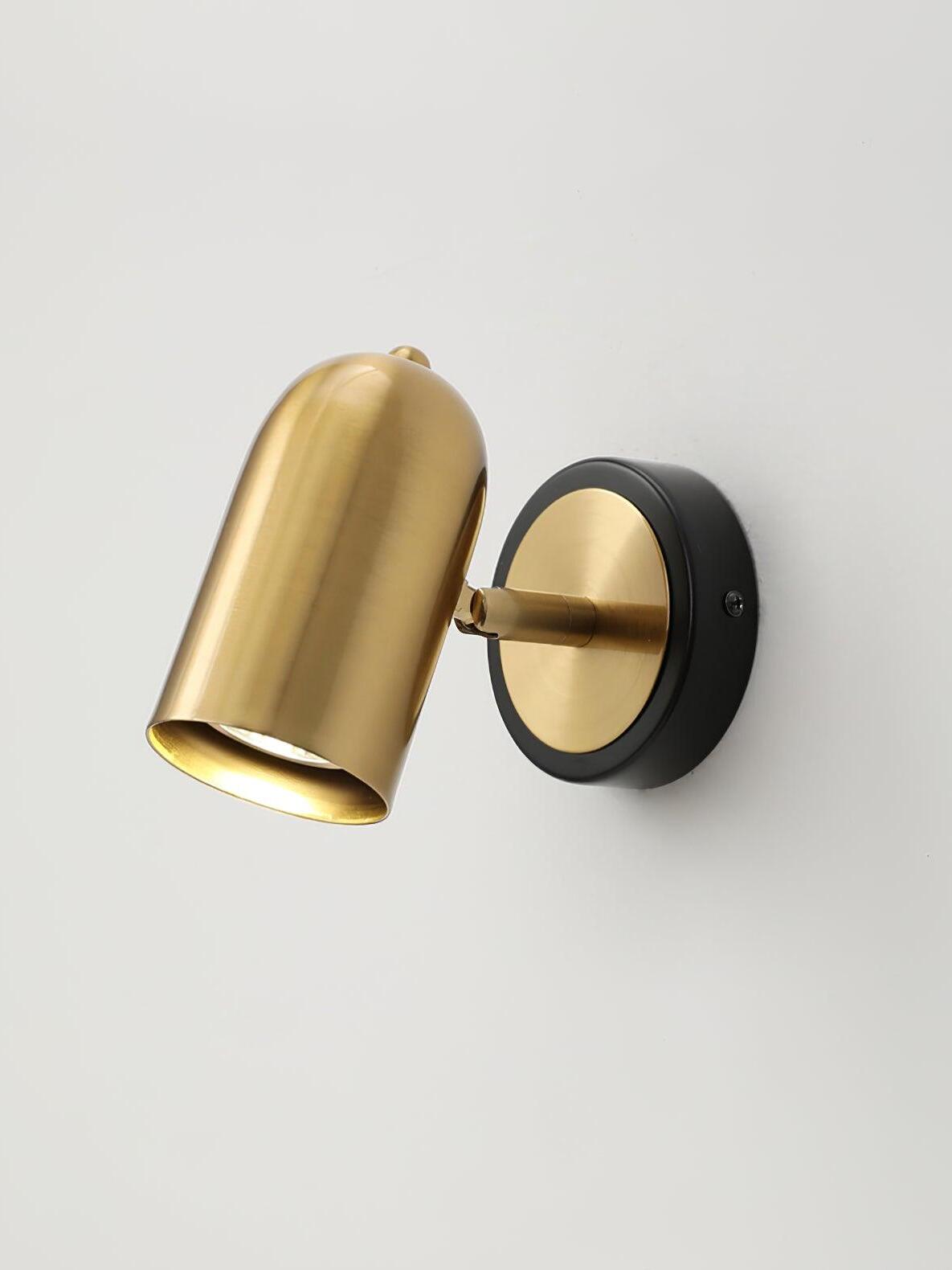 Gold wall lamp head upright on circular backplate