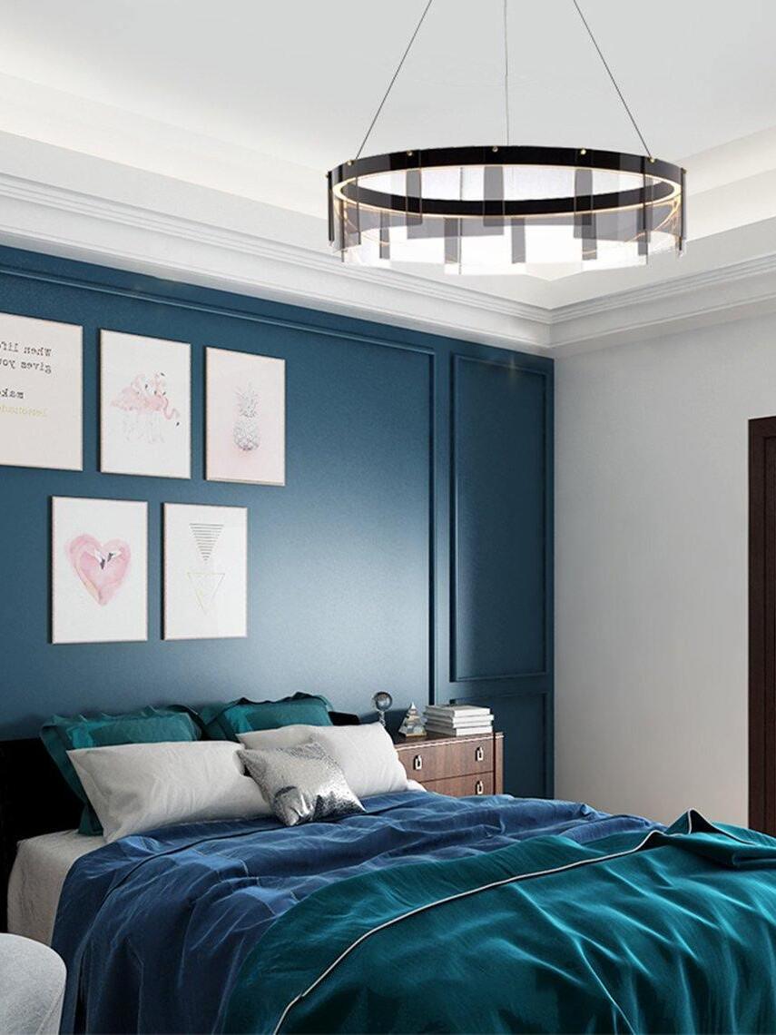 Black glass ring chandelier in a blue bedroom